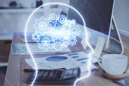 Multi exposure of work space with computer and human brain hologram. Brainstorm concept.