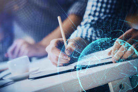 Man's hands working with notes background. Social networking concept. Crowd sourcing. Global...