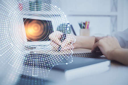 Multi exposure of writing hand on background with brain hologram. Concept of learning.