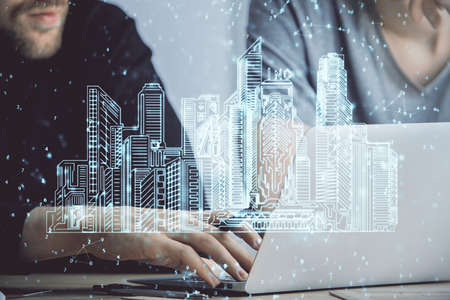 High tech city drawing with businessman working on computer on background. Smartcity concept. Double...