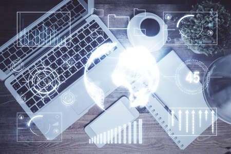 Financial market graph and top view computer on the desktop background. Double exposure. Investment concept.の写真素材