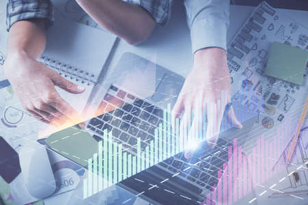 Double exposure of man and woman working together and forex graph hologram drawing. Financial...