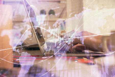 Double exposure of woman hands typing on computer and forex chart hologram drawing. Stock market...
