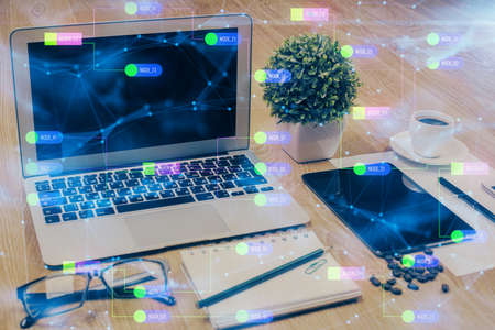 Double exposure of table with computer on background and data theme drawing. Concept of innovation.の写真素材