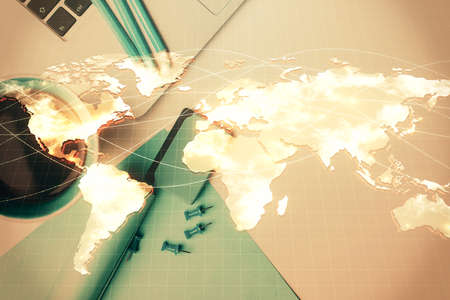 Business theme hologram drawings over computer on the desktop background. Top view. Multi exposure. Concept of international connections.の写真素材