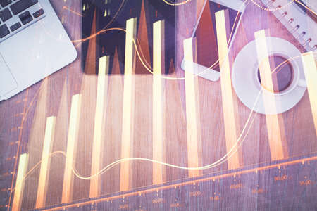 Multi exposure of forex graph hologram over desktop with phone. Top view. Mobile trade platform concept.の写真素材