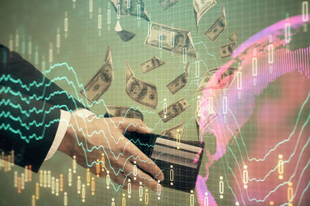 Multi exposure of financial graph drawing hologram and USA dollars bills and man hands. Analysis...