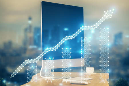 Financial graph colorful drawing and table with computer on background. Double exposure. Concept of...