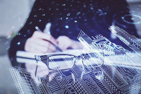 IOT drawing over writing hands in notepad background. Concept of smaert home. Multi exposureの写真素材