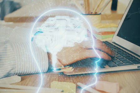 Man typing on keyboard background with brain hologram. Concept of big Data. Double exposure.
