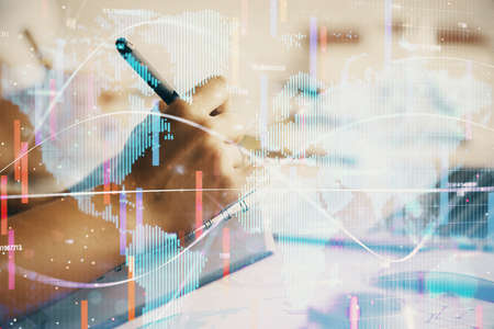 Double exposure of business theme drawing over people taking notes background. Concept of financial...