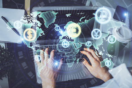 Double exposure of woman hands typing on computer and forex chart hologram drawing. Stock market...
