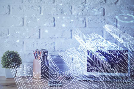 Desktop computer background in office and big town buildings hologram drawing. Double exposure. Smart city concept.の写真素材