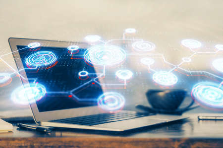 Computer on desktop with social network hologram. Multi exposure. Concept of international people...