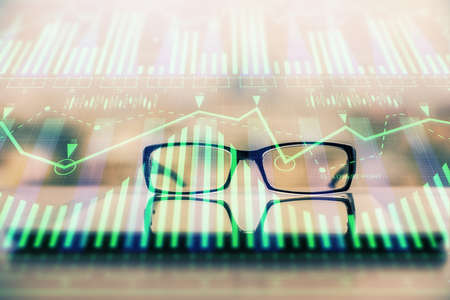 Data tech hologram with glasses on the table background. Concept of technology. Double exposure.の写真素材