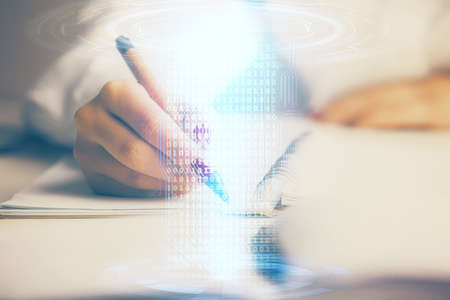 Multi exposure of womans writing hand on background with data technology hologram. Concept of innovation.の写真素材