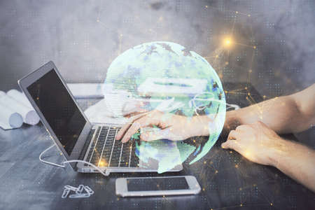 Social network theme hologram with businessman working on computer on background. Concept of world wide web. Double exposure.の写真素材