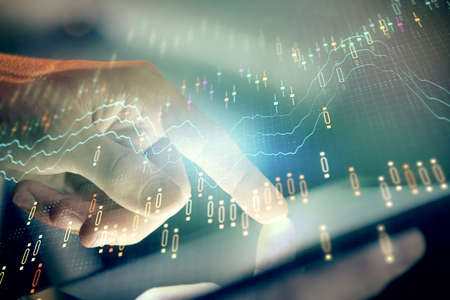 Multi exposure of mans hands holding and using a phone and financial chart drawing. Market analysis...