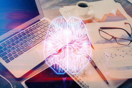 Double exposure of desktop with computer and brain drawing hologram. Artificial intelligence concept.の写真素材