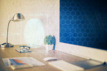 Computer on desktop in office with finger print drawing. Double exposure. Concept of business data security.の写真素材