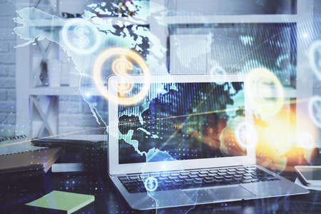 Stock market graph on background with desk and personal computer. Multi exposure. Concept of...