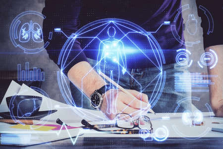 Mans hands working with notes background. Scientist checklist or entry data, research and experiment...