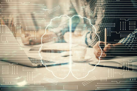 Man typing on keyboard background with brain hologram. Concept of big Data.の写真素材