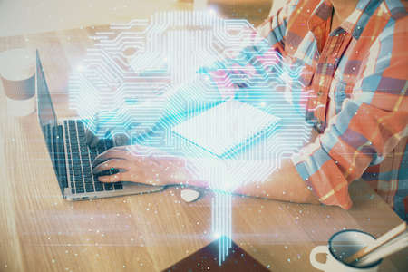 Man typing on keyboard background with brain hologram. Concept of big Data.
