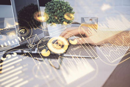 Technology theme hologram with man working on computer on background. High tech concept. Multi...