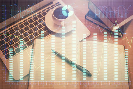 Stock market graph and top view computer on the table background. Multi exposure. Concept of...