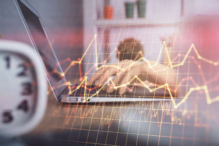 Double exposure of woman hands typing on computer and forex chart hologram drawing. Stock market...