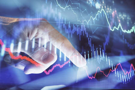 Multi exposure of mans hands holding and using a phone and financial chart drawing. Market analysis...