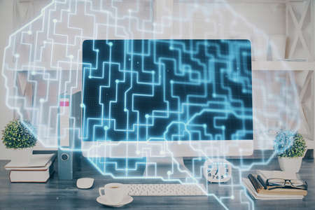 Double exposure of desktop with computer and brain drawing hologram. Artificial intelligence...