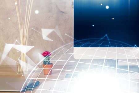 Double exposure of desktop with computer and world map hologram. International data network concept.