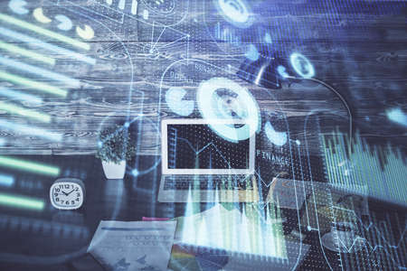 Double exposure of laptop computer and technology theme hologram. Concept of freelance work.