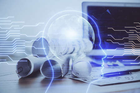 Double exposure of table with computer and brain hologram. Data innovation concept.
