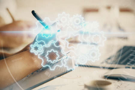 Double exposure of business theme drawing over people taking notes background. Concept of financial worldの写真素材