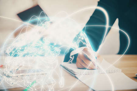 Double exposure of business theme drawing over people taking notes background. Concept of financial worldの写真素材