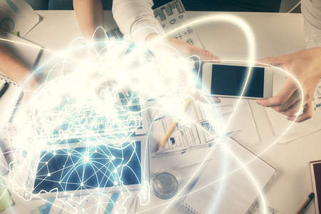Double exposure of man and woman working together and business theme hologram drawing. Computer...
