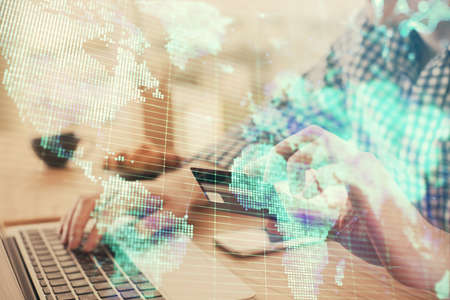 Double exposure of man hands holding a credit card and internet business theme drawing. Digital fintech and E-commerce concept.の写真素材