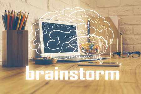 Desktop computer background in office and start up theme hologram drawing. Double exposure. Startup concept.の写真素材