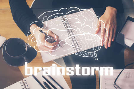 Start up creative drawing over close up hands on background. Concept of brainstorming. Multi exposureの写真素材