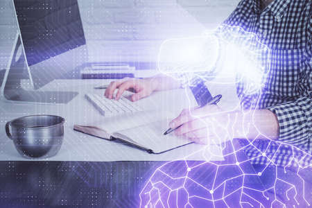 AR hologram with man working on computer on background. Augmented reality concept. Double exposure.