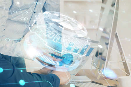 Multi exposure of tech drawings with man working on computer background. Concept of innovation.の写真素材