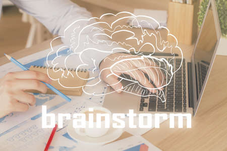 Start up drawings with businessman working on computer on background. Teamwork concept. Double exposure.の写真素材