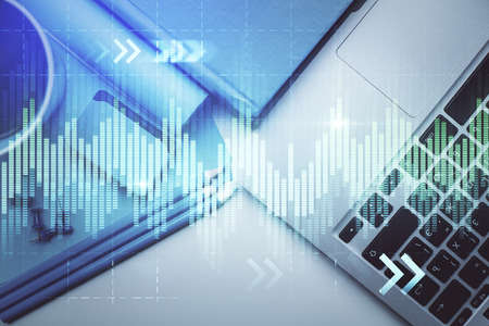 Double exposure of forex graph drawing over desktop background with computer. Concept of financial analysis. Top view.の写真素材