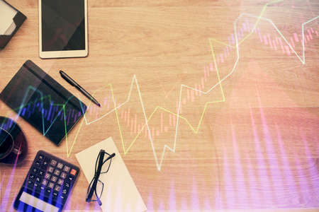 Double exposure of forex graph drawing and work table top veiw. Concept of financial analysis.の写真素材