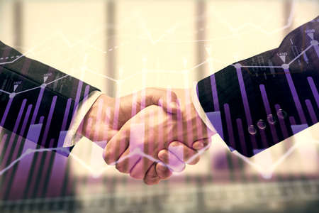 Double exposure of forex graph hologram and handshake of two men. Stock market concept.