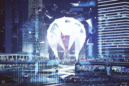 Multi exposure of bulb hologram drawing and cityscape background. Concept of idea.