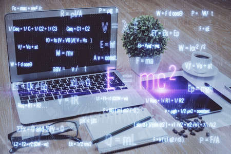Desktop computer background and formula hologram writing. Double exposure. Education concept.